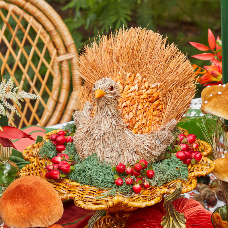 Decorative turkey figure intricately designed with raffia material.