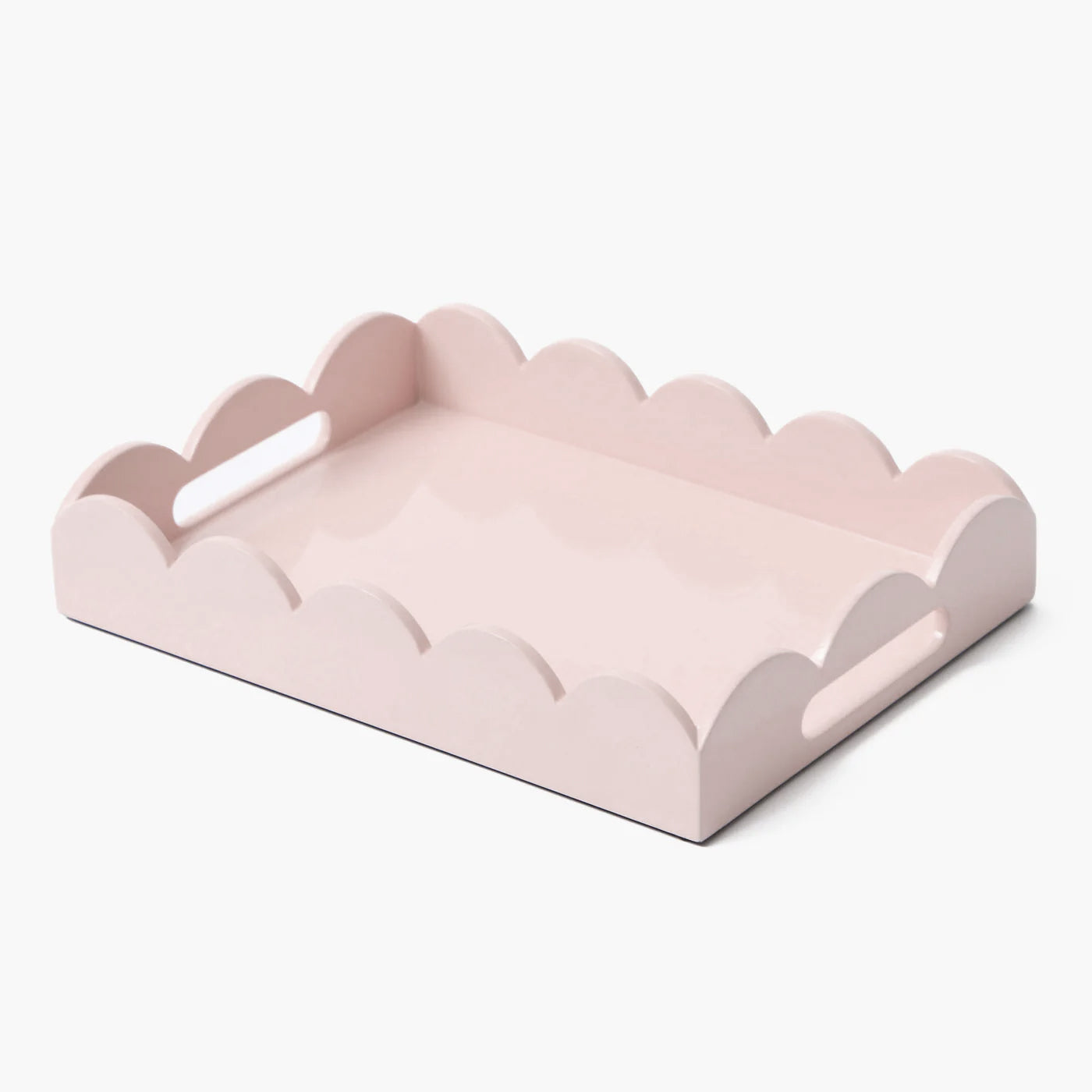 Pink scalloped-edge tray on a white background