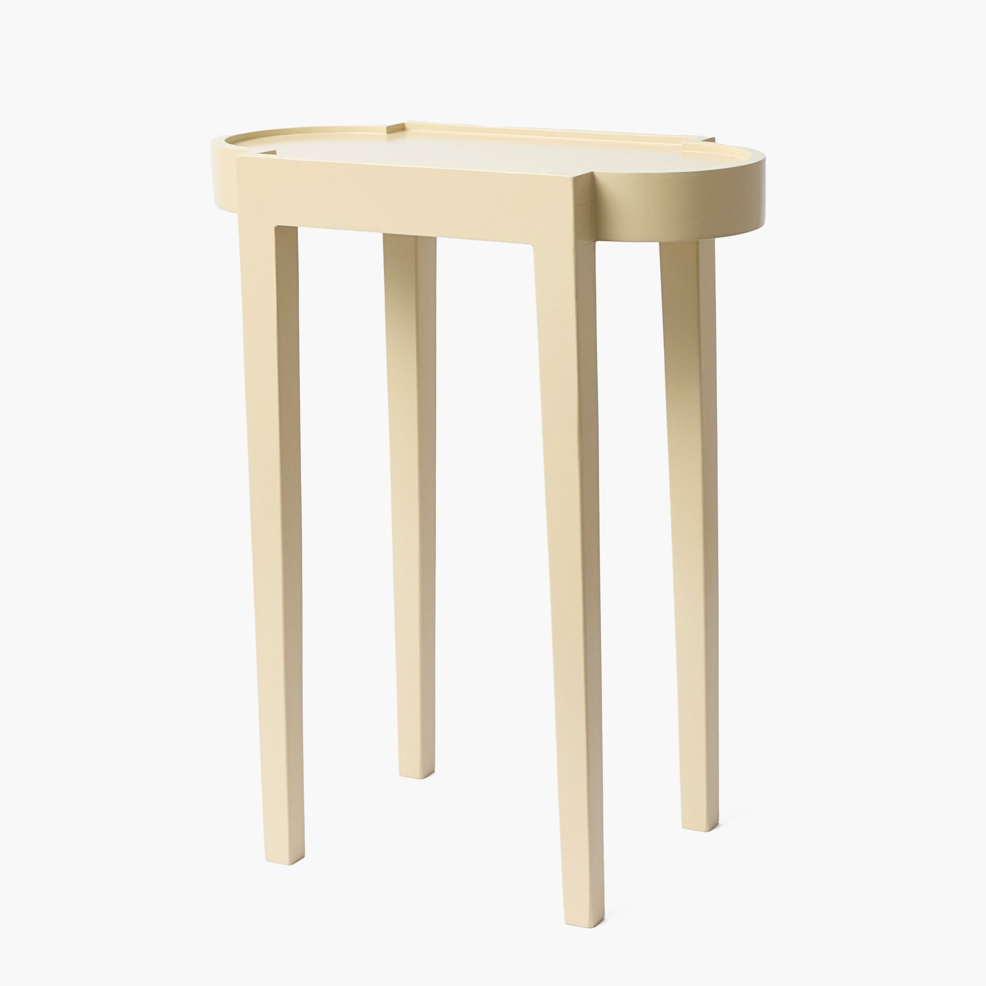 Beige side table with a white top on a white background