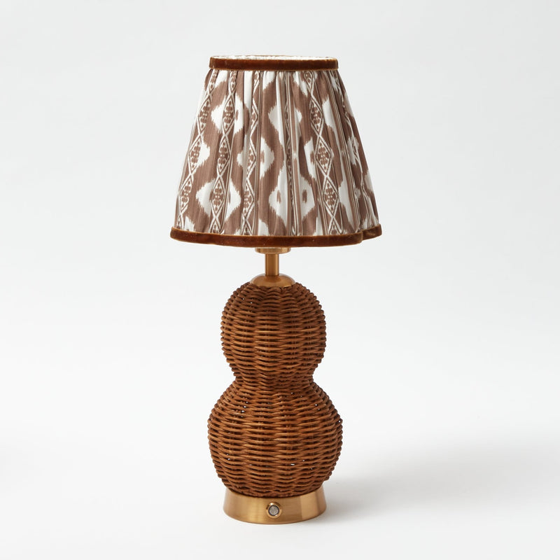 Brighten your decor with the comforting and inviting presence of the Rattan Bardot Rechargeable Lamp, ideal for adding a touch of timeless elegance to your space.