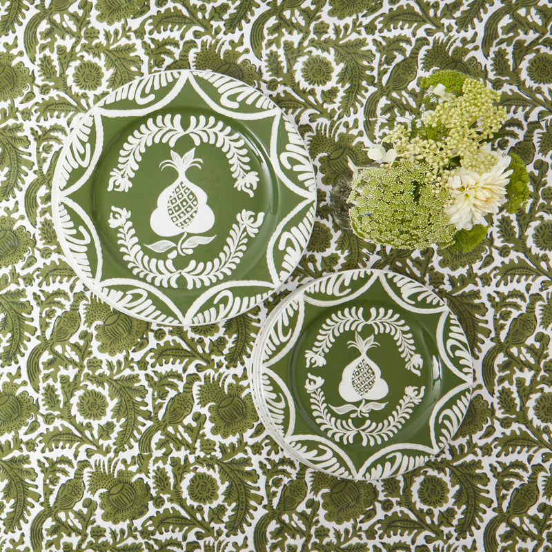 Four starter plates adorned with charming olive and pomegranate designs.