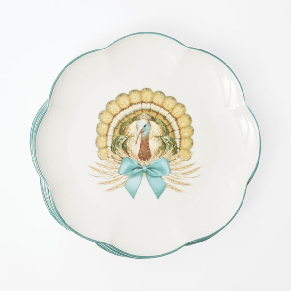 Scalloped dinner plate featuring an elegant turkey design.