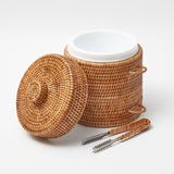 Ice bucket crafted from natural rattan material.