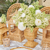 Small-sized urn vase offering elegant simplicity in natural rattan.