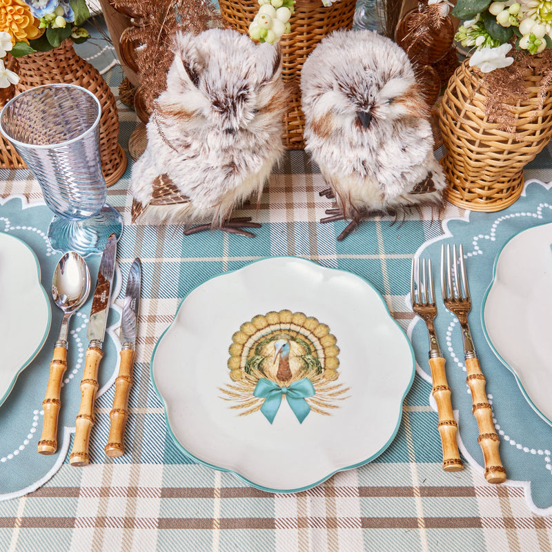 Scalloped plate showcasing a festive turkey pattern.