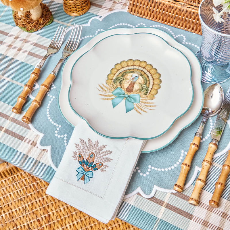 Scalloped starter plate adorned with a charming turkey motif.