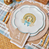 Scalloped dish featuring an artistic depiction of a turkey.