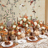 Shaded pheasant-themed tablecloth, adding elegance to the table.
