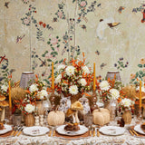 Decorative tablecloth patterned with subtle shaded pheasant designs.