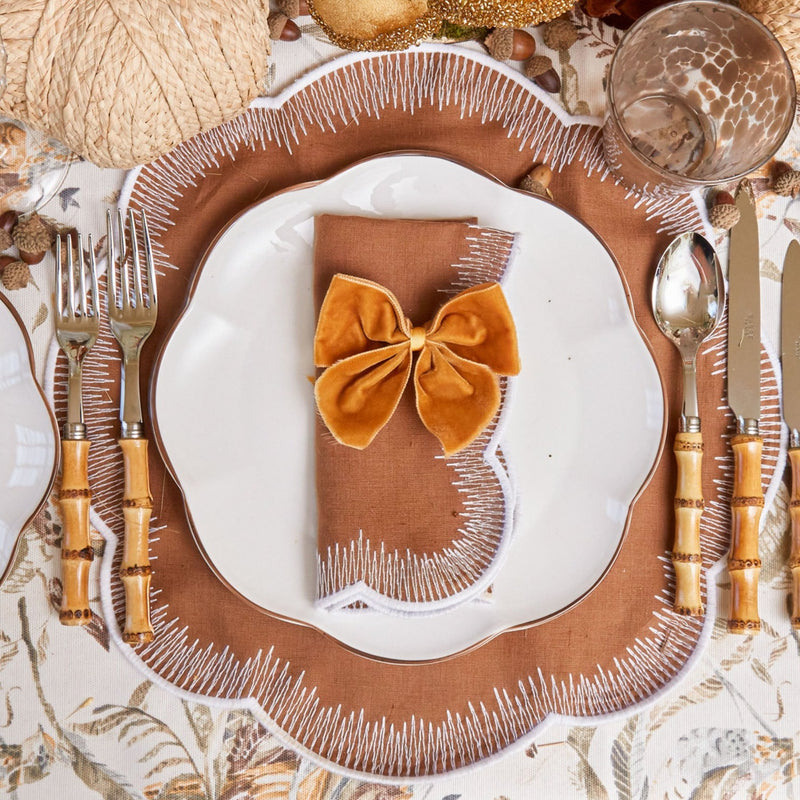 Enhance the visual appeal of your table decor with the sophisticated Set of 4 Mustard Velvet Napkin Bows.