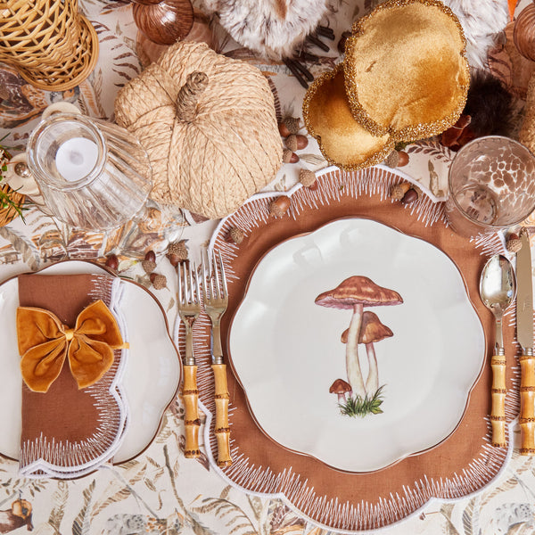 Add a touch of sophistication to your table setting with the exquisite Scalloped Mushroom Dinner Plate.
