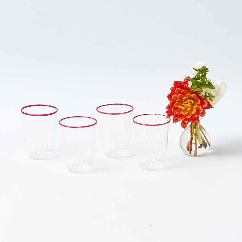 Elevate your Christmas beverage experience with our Set of 4 Red Rim Water Glasses - a simple yet stylish statement of holiday drinkware sophistication.
