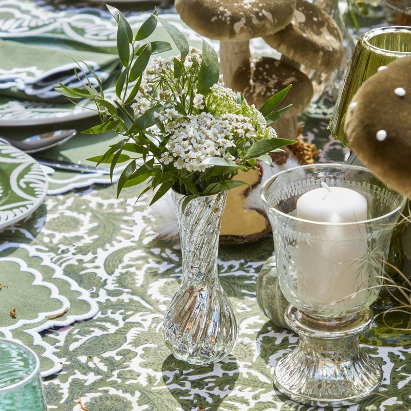 Enhance your decor with the stylish presence of vintage mercury glass vases, courtesy of the Trio of Mercury Bud Vases, perfect for adding a touch of elegance and a touch of history to your arrangements.