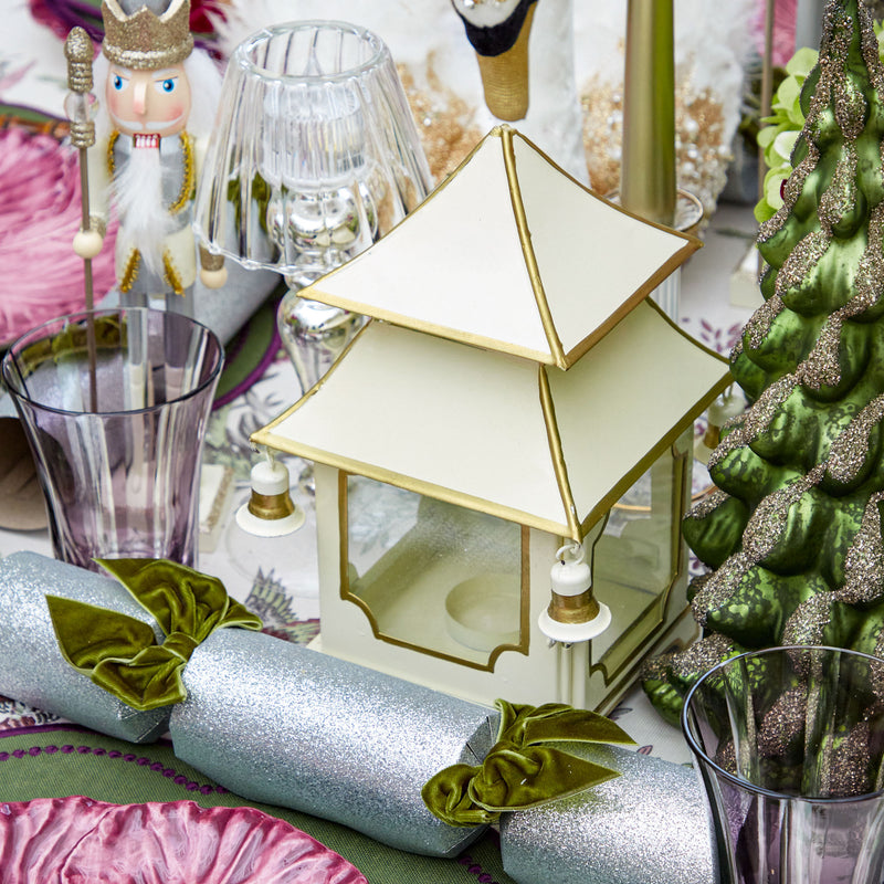 Create a festive and enchanting Christmas atmosphere with the White With Gold Mini Pagoda Lanterns, perfect for infusing your space with a touch of holiday charm.