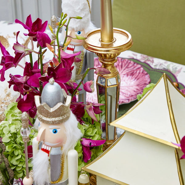 Create an ambiance of luxury with the Gold Mirrored Candle Holder Pair, perfect for adding a warm and elegant glow to your setting.
