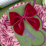 Add a regal touch to your dining experience with Aubergine Napkin Bows.