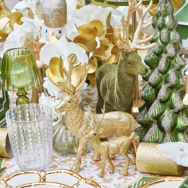 Create a whimsical ambiance with the Set of 3 Small Gold Glitter Reindeer - the ideal choice for adding a touch of Christmas magic to your home.