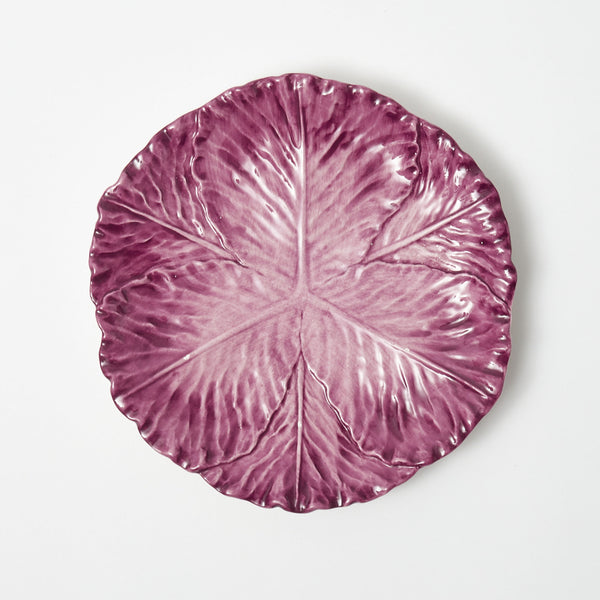 Elevate your dining experience with the Serena Aubergine Cabbage Dinner Plate, a stunning addition that brings a touch of artistic elegance to your table.
