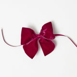 Create a royal ambiance with the addition of Aubergine Napkin Bows.