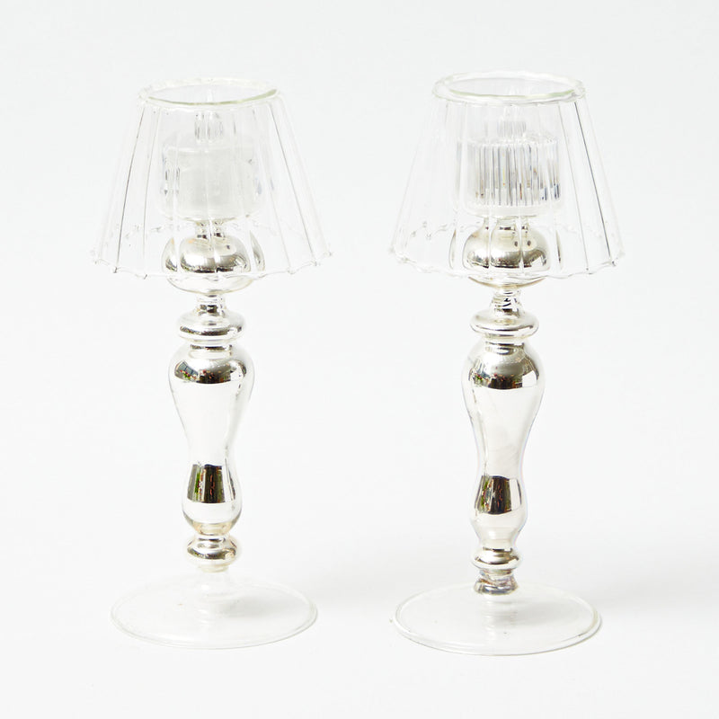 Illuminate your space with the Silver Stem Tealight Lantern Pair, a sophisticated and radiant duo that adds a touch of shimmering charm to your decor.