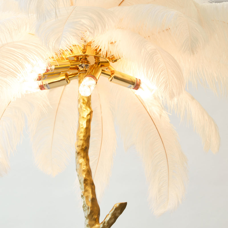 Turn your space into a sanctuary of elegance with the Marlene White Feather Floor Lamp, an enchanting lamp that infuses your surroundings with the warmth and luxury of feathers.