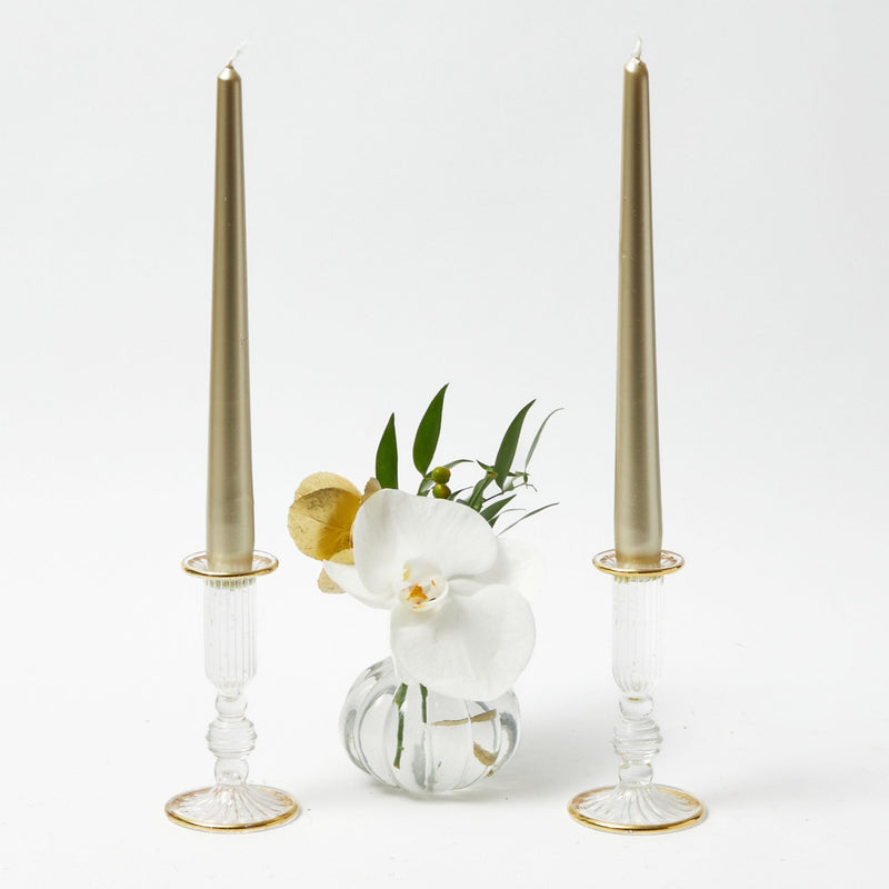 Enhance your holiday gatherings with the classic charm of our Pair of Joy Gold Fluted Candle Holders, designed to bring a touch of elegance to your Christmas festivities.