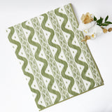 Elevate your dining experience with the Olive Green Ikat Tablecloth, a stylish addition that brings a touch of elegance to your table.