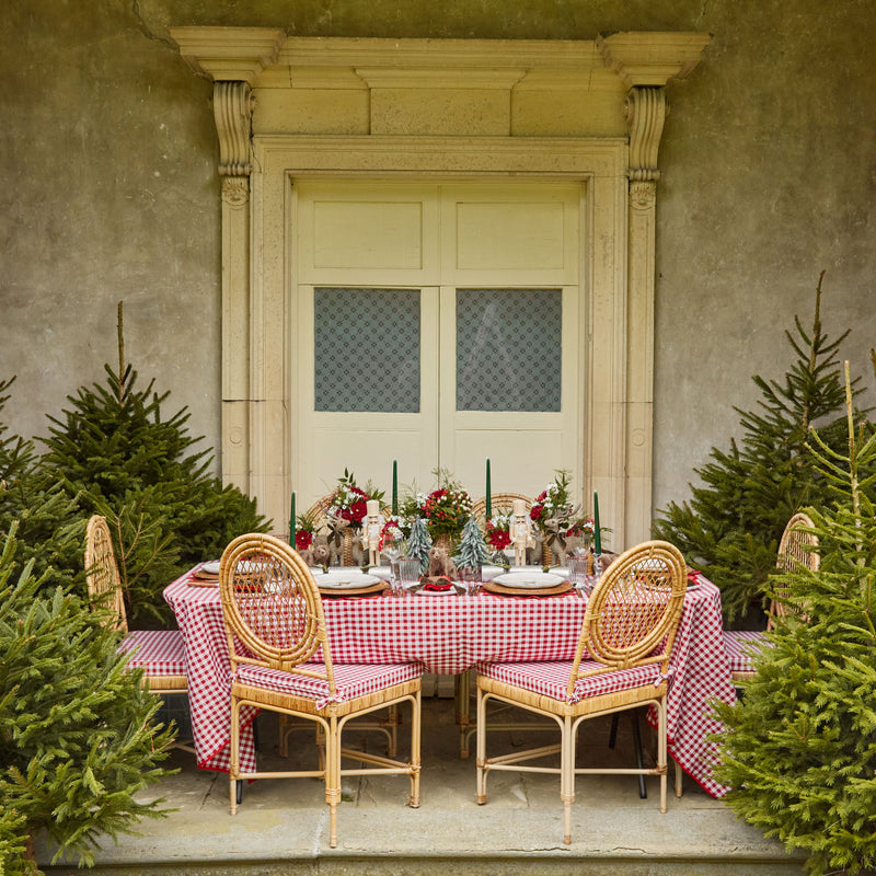 Create a warm and welcoming table with the Berry Red Gingham Tablecloth, adorned with a classic gingham pattern that embodies the cozy spirit of the holidays.