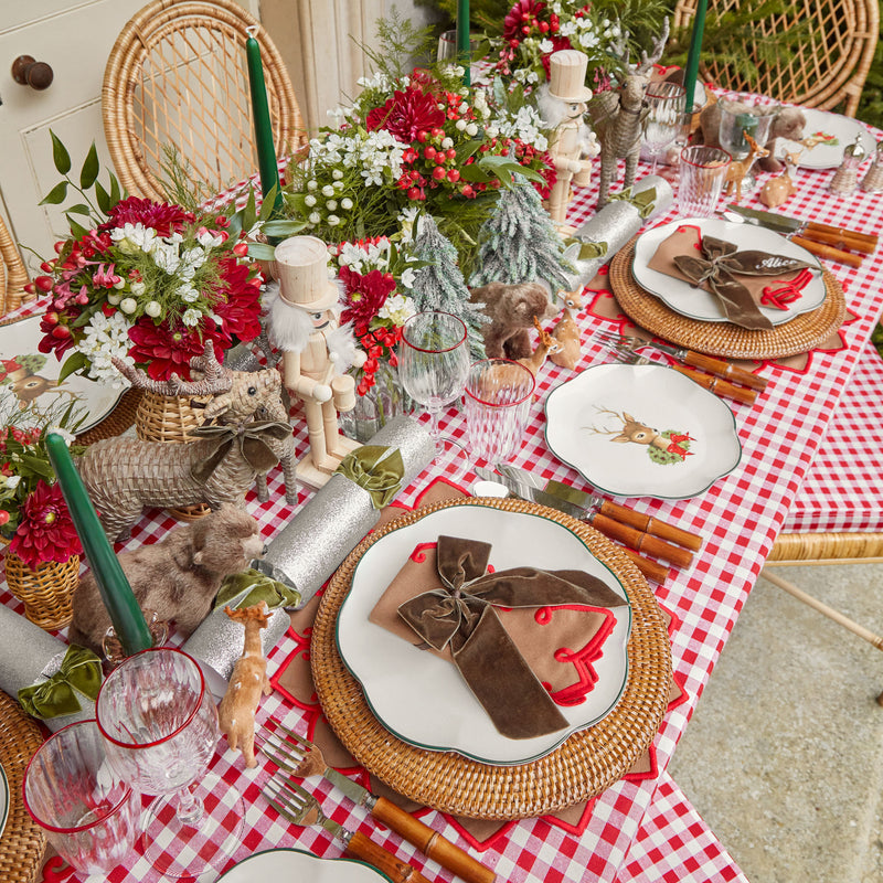 Turn your dining table into a festive masterpiece with the Berry Red Gingham Tablecloth, a classic and nostalgic piece that infuses your celebrations with the joy of the holidays.
