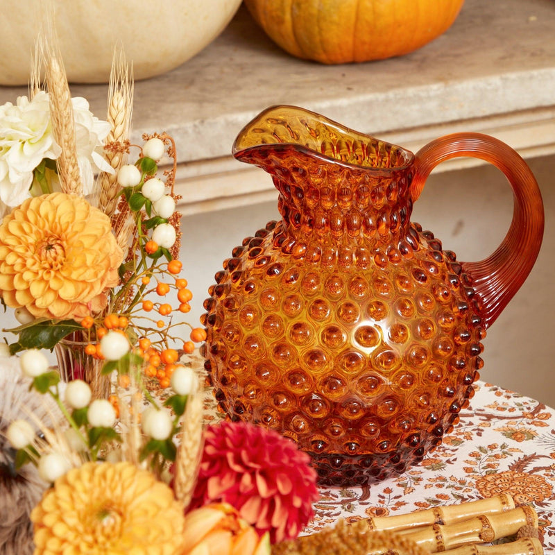 Create a vintage-inspired ambiance with the Amber Hobnail Jug, perfect for serving your favorite beverages in style.