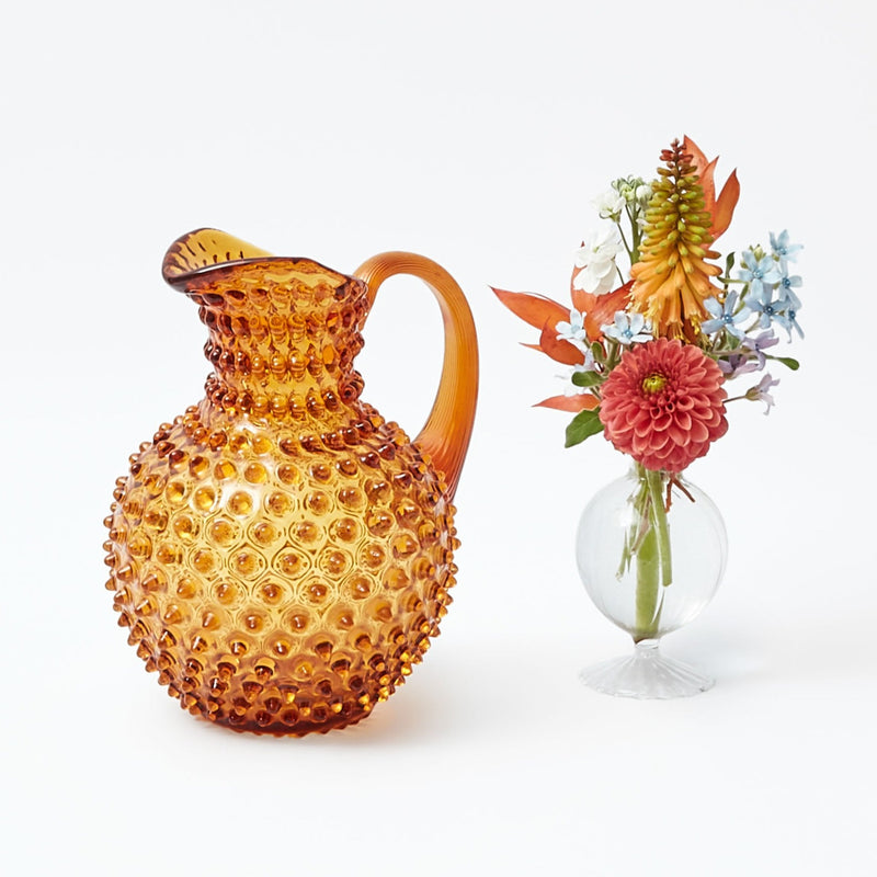 Elevate your table setting with the timeless elegance of the Amber Hobnail Jug, a stylish addition to any occasion.