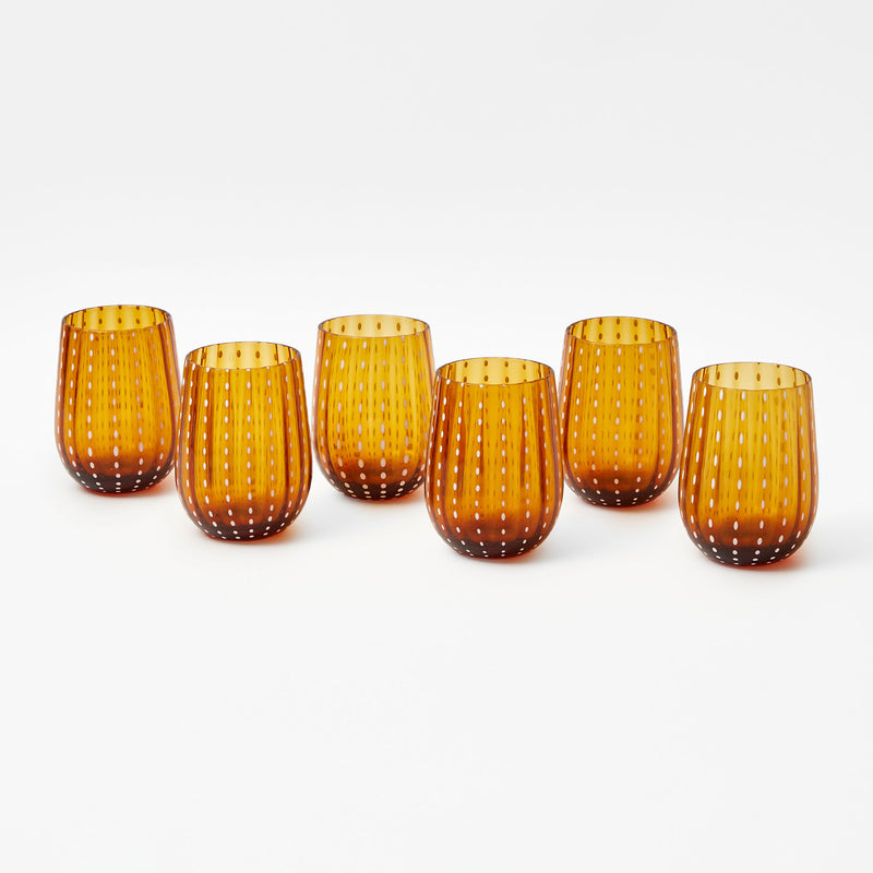Make a statement with the warm hue and speckled design of the Amber Speckle Water Glasses (Set of 11).