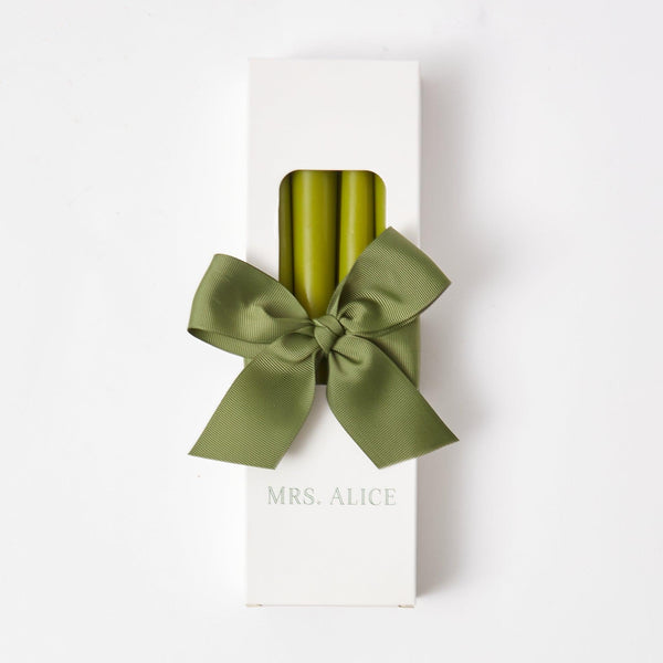 Illuminate your space with the lively glow of Apple Green Candles in this charming set of 8.