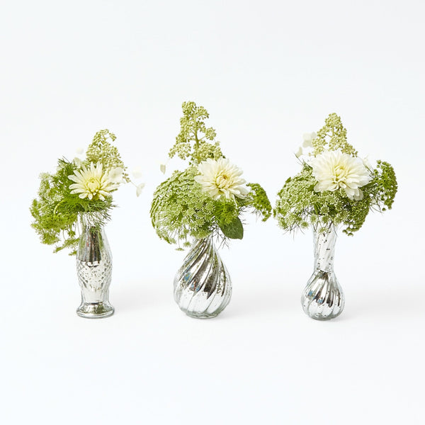 Create a captivating centerpiece with the Trio of Mercury Bud Vases, featuring a trio of vases designed to add a touch of sophistication and a vintage mercury glass finish to your decor.