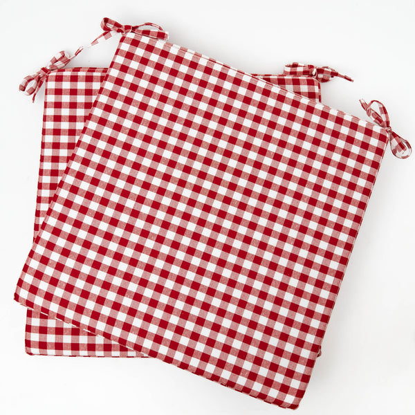 Elevate your dining experience with the Berry Red Gingham Seat Pad Cushion, a comfortable and stylish addition that adds a pop of berry red charm to your chairs.