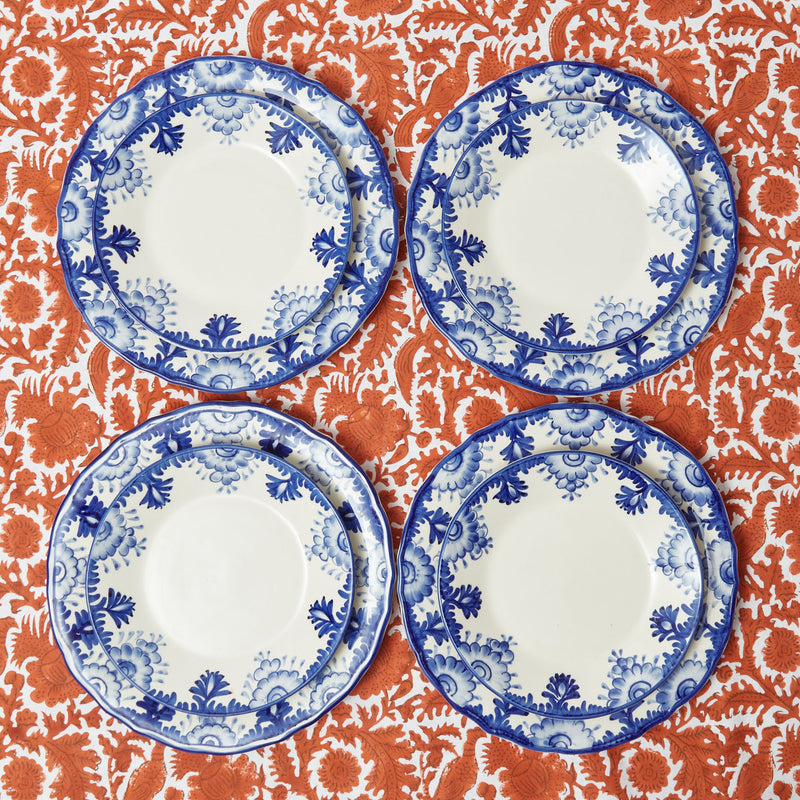Four dinner and starter plates featuring the refined Blue Deauville motif in harmonious coordination.