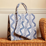 Add a touch of elegance to your ensemble with "The Tote-ally Fabulous" Giftscape, including the Blue Ikat Pochette (Zip fastening).