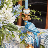 Set the mood with the playful charm of the Blue Parrot Candle Holder, presented in a pair of 16 for a cohesive look.