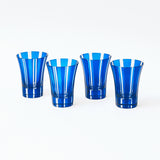 Four Positano glasses featuring a striking royal blue shade.