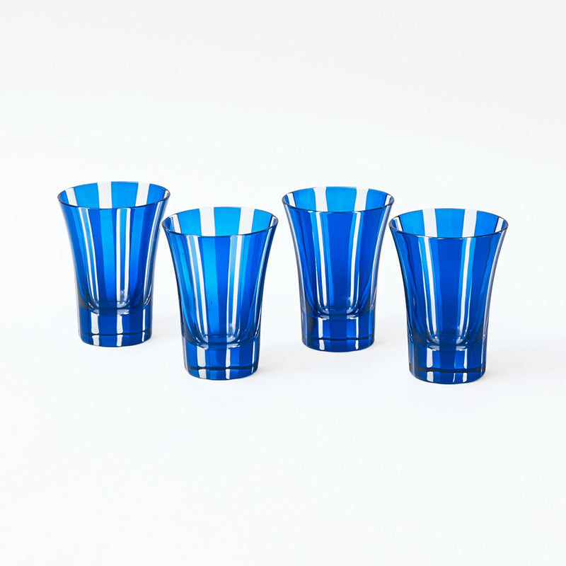 Four Positano glasses featuring a striking royal blue shade.