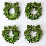 Enhance your Christmas decor with the timeless beauty of the Set of 4 Boxwood Wreaths, perfect for creating a warm and inviting atmosphere throughout your home.