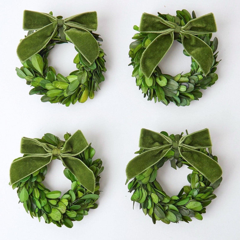 Enhance your Christmas decor with the timeless beauty of the Set of 4 Boxwood Wreaths, perfect for creating a warm and inviting atmosphere throughout your home.