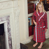 Enhance their relaxation routine with the playful and delightful Children's Red Tartan Frilled Dressing Gown - a cozy addition that's perfect for staying warm and stylish.