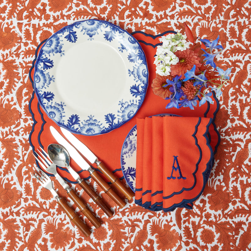 Tablecloth boasting burnt orange tones with graceful pheasant motifs.