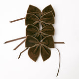 Mrs. Alice adds a touch of elegance with Chocolate Brown Napkin Bows (Set of 4).