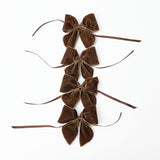 A glimpse into Mrs. Alice's refined taste with Chocolate Brown Napkin Bows (Set of 4).