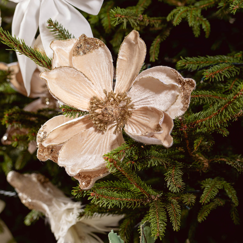 The Clip On Champagne Flower Ornament adds a touch of shimmer to your holiday decor.