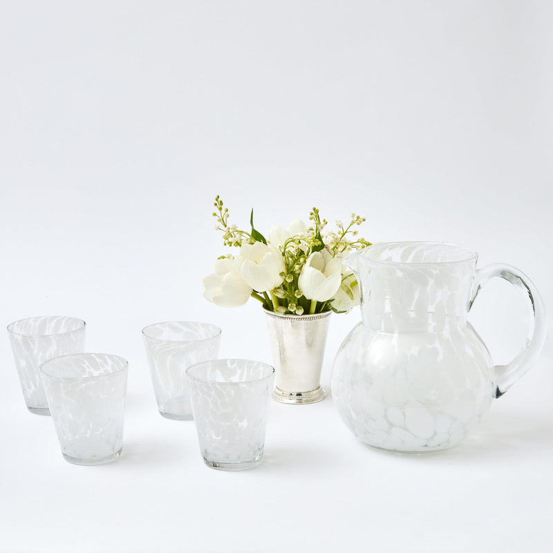 Elevate your drinking experiences with our set of 4 Dappled White Water Glasses - a symbol of quality and taste.