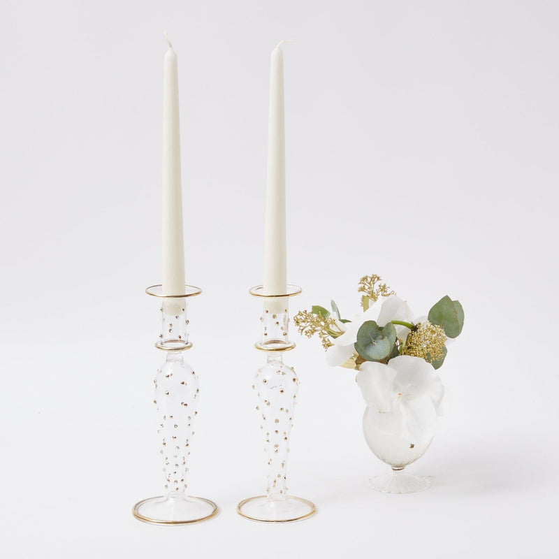 Add a touch of sophistication and refinement to your living space with the Dotty Gold Candle Holder Pair, designed to bring luxury and candlelit warmth to your home.