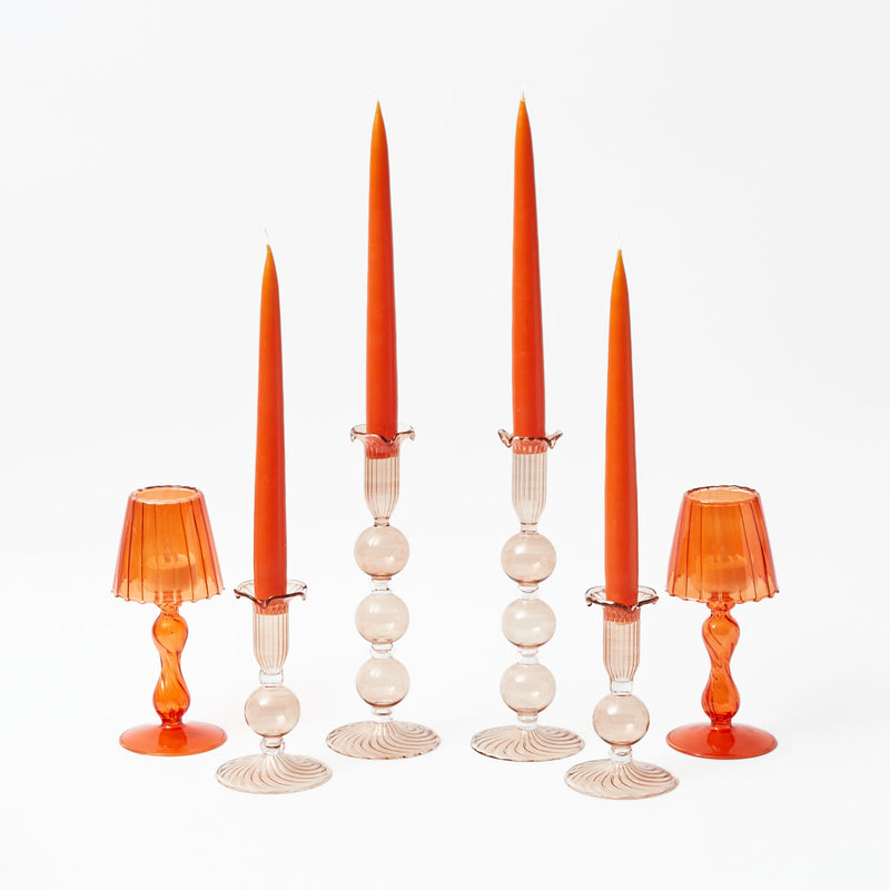 Orange glass lanterns, sold as a pair, standing at 18 cm for tea lights.
